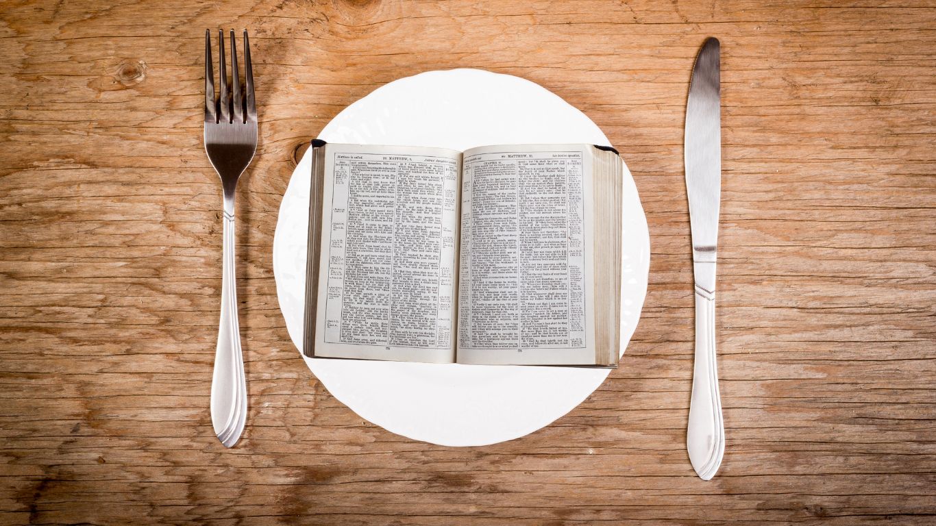 Bible on a plate with fork